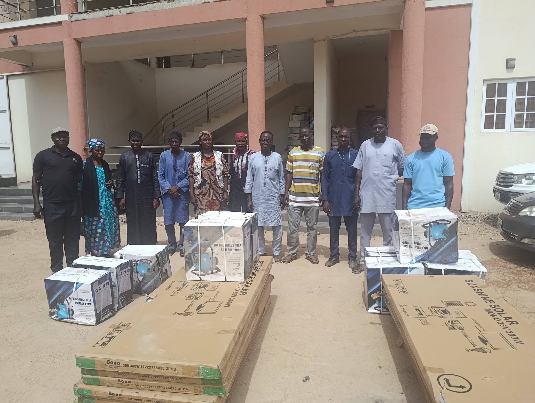 Community members with solar water pump equipment